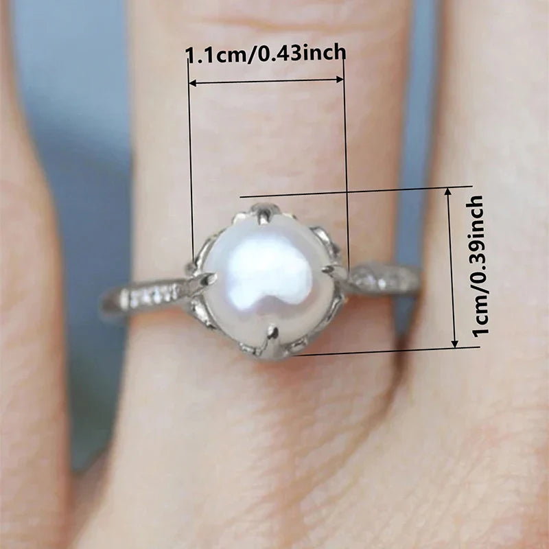 Gouden ring met grijze parel en kristallen