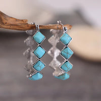 Zilveren oorbellen met turquoise kralen en kristal
