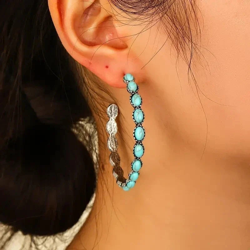 Zilveren oorbellen met ovale turquoise stenen