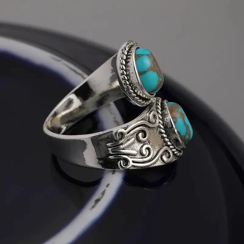 Zilveren vintage wikkelring met turquoise stenen