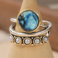 Zilveren ringenset met blauwe steen en parels