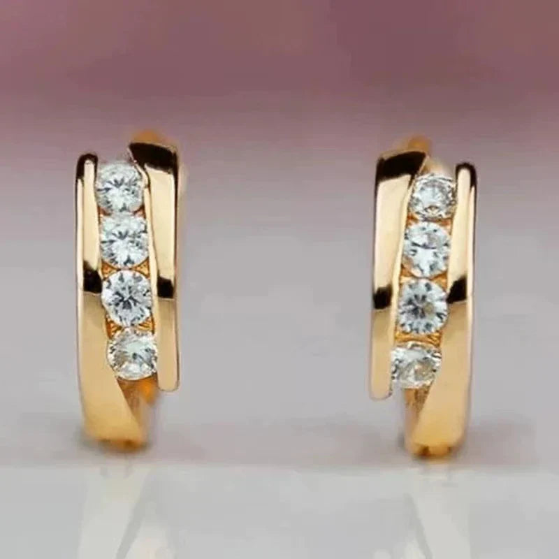 Gouden huggie oorbellen met zirconia