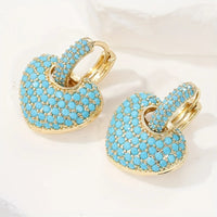 Gouden hart-oorbellen met turquoise pavé