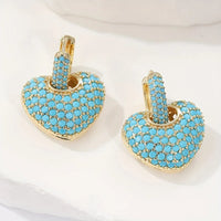Gouden hart-oorbellen met turquoise pavé