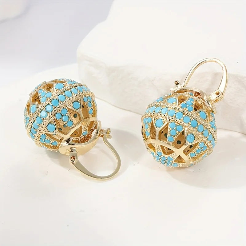 Gouden bolhanger-oorbellen met turquoise kralen