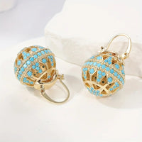 Gouden bolhanger-oorbellen met turquoise kralen