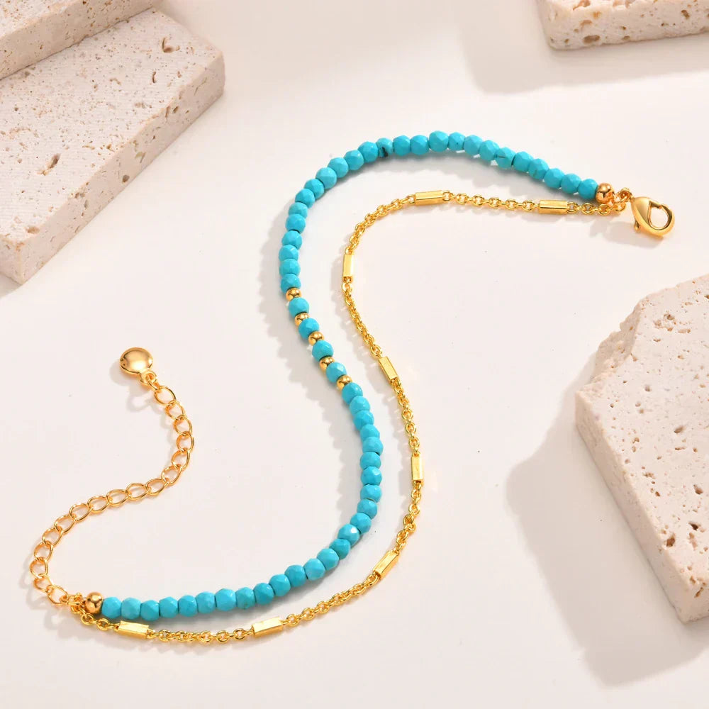 Gouden armband met turquoise kralen