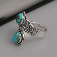 Zilveren vintage wikkelring met turquoise stenen