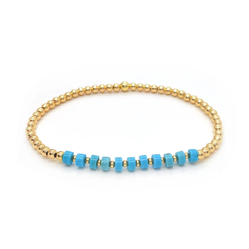 Gouden armband met turquoise kralen