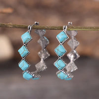 Zilveren oorbellen met turquoise kralen en kristal