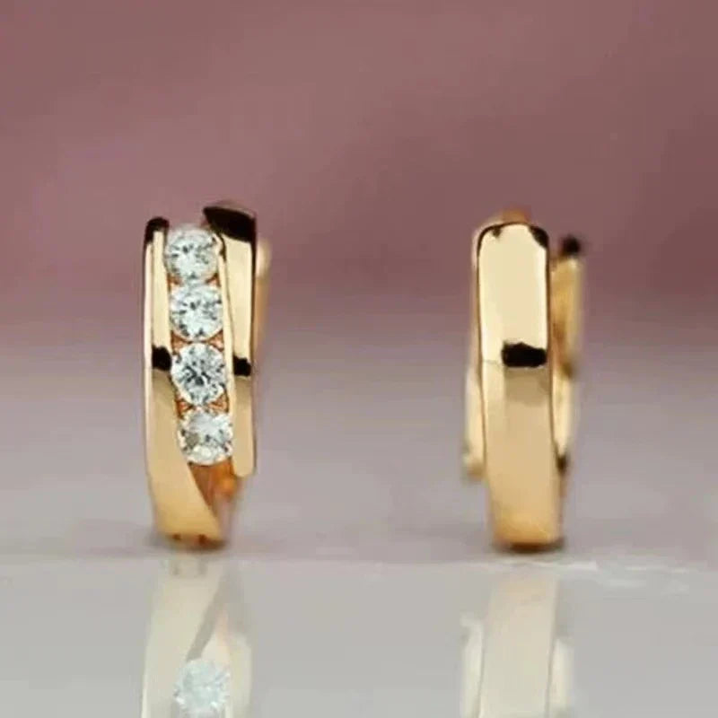 Gouden huggie oorbellen met zirconia