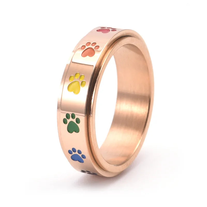 Roségouden anti-stress ring met regenboog pootjes
