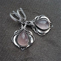 Zilveren vintage oorbellen met roze druppelstenen