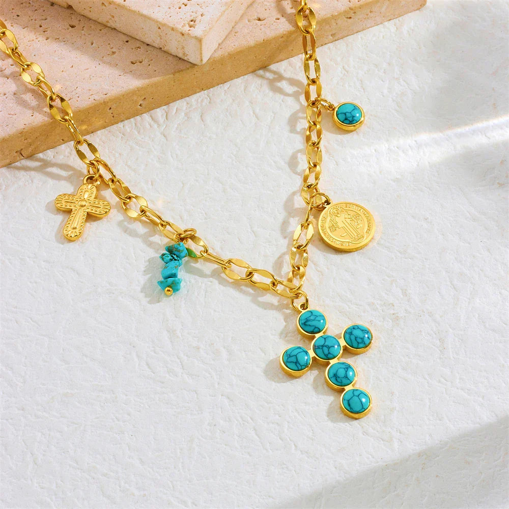 Gouden bedelketting met turquoise kruis