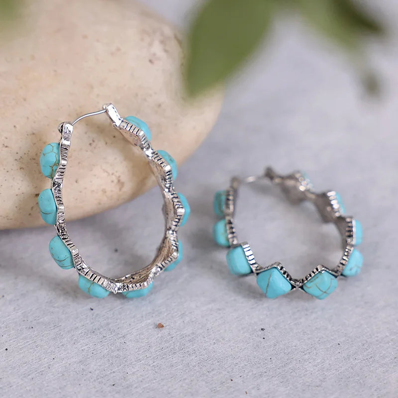 Zilveren oorbellen met turquoise kralen en kristal