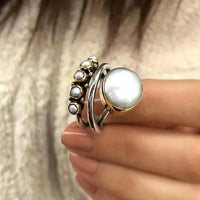 Zilveren ring met parel en parelkroon