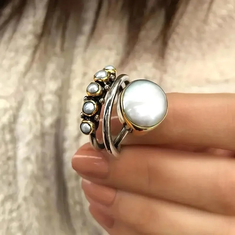 Zilveren ring met parels en gouden accenten