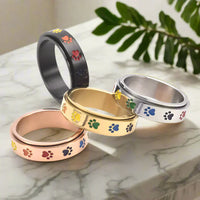 Roségouden anti-stress ring met regenboog pootjes