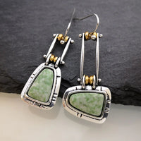 Zilveren vintage oorbellen met groene edelsteen