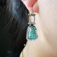 Zilveren vintage oorbellen met groene edelsteen