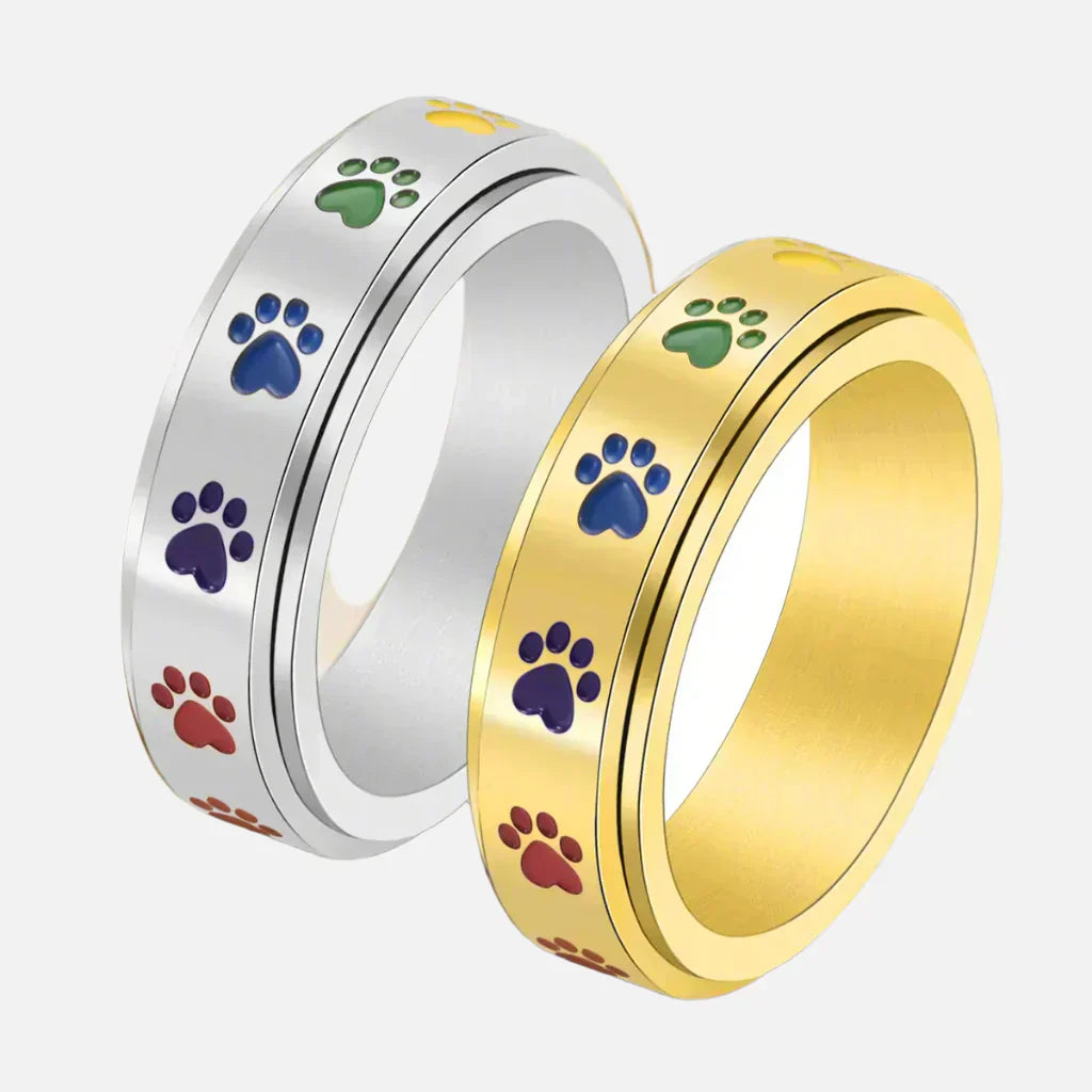 Roségouden anti-stress ring met regenboog pootjes