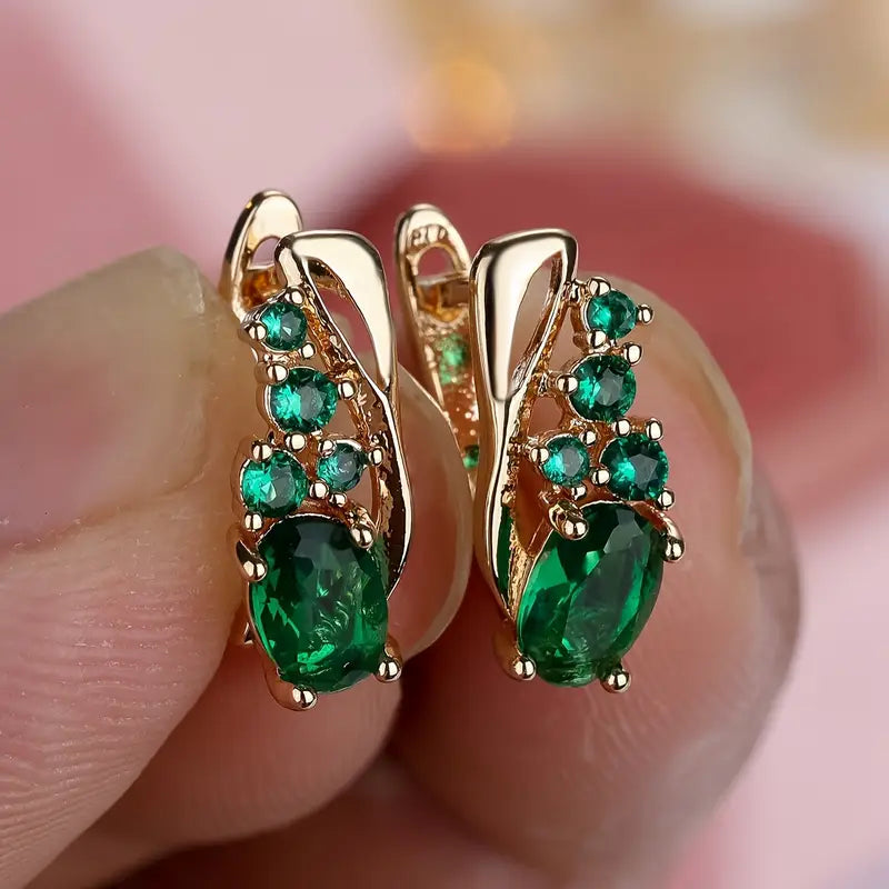Gouden oorbellen met groene edelstenen