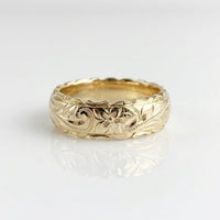 Gouden vintage ring met gegraveerd bloemmotief