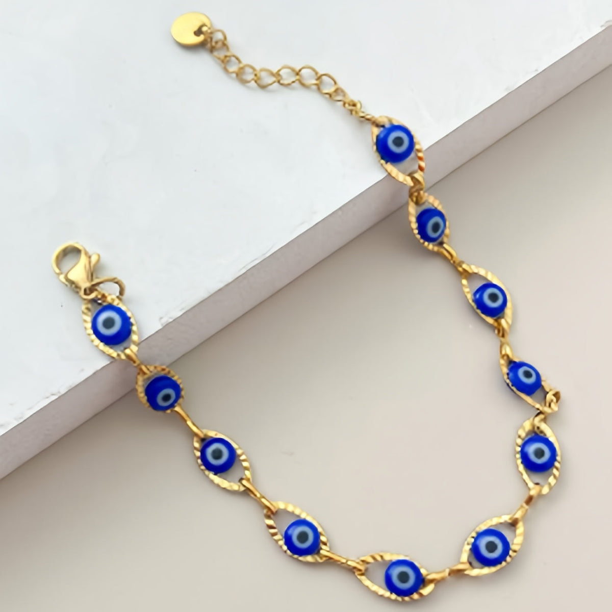 Gouden armband met blauwe boze oog kraaltjes