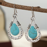 Zilveren oorbellen met wire-wrapped turquoise druppel