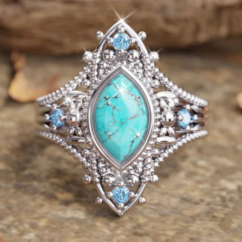 Zilveren vintage ring met marquise turkoois en blauwe steentjes