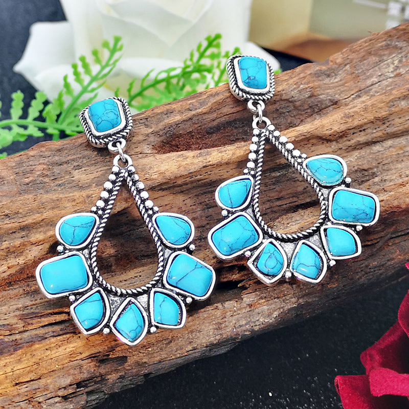 Zilveren bohemian oorbellen met turquoise waaier