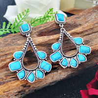 Zilveren bohemian oorbellen met turquoise waaier