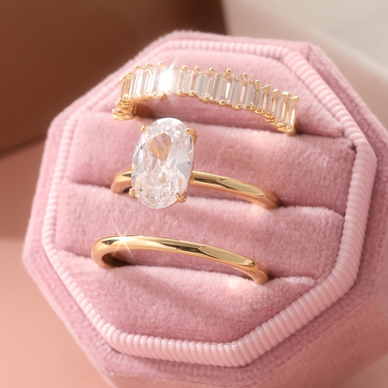 Gouden ring met ovale zirkonia en baguette band