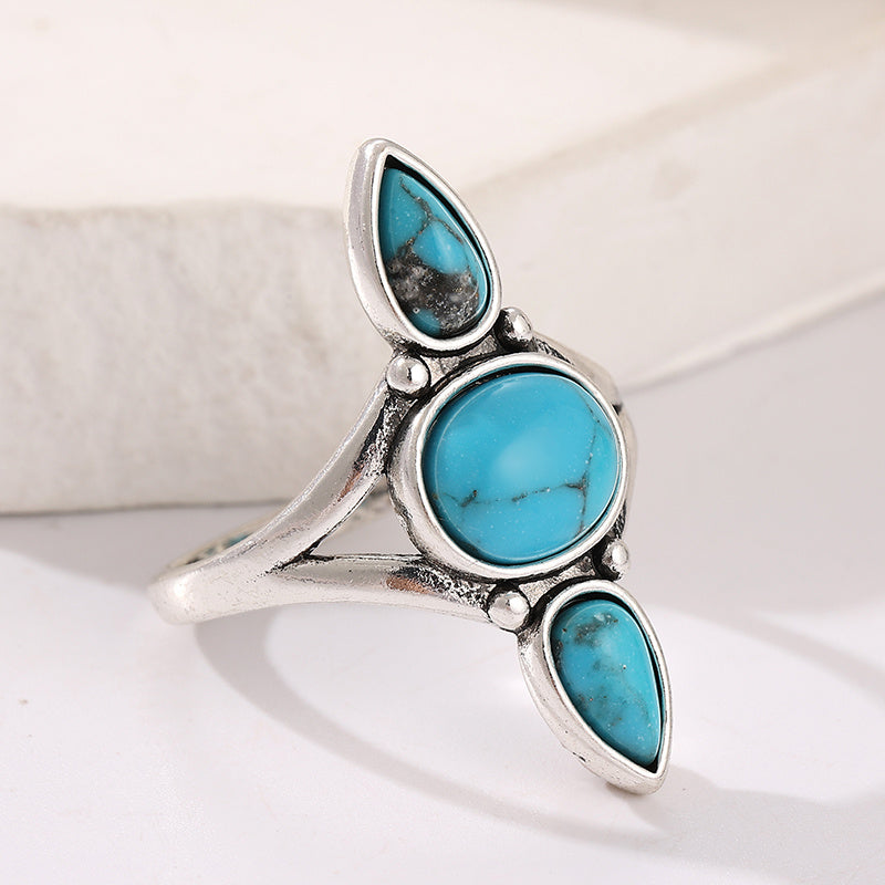 Zilveren ring met drie turquoise edelstenen