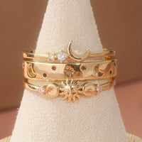 Gouden ringenset met zon, maan en sterren