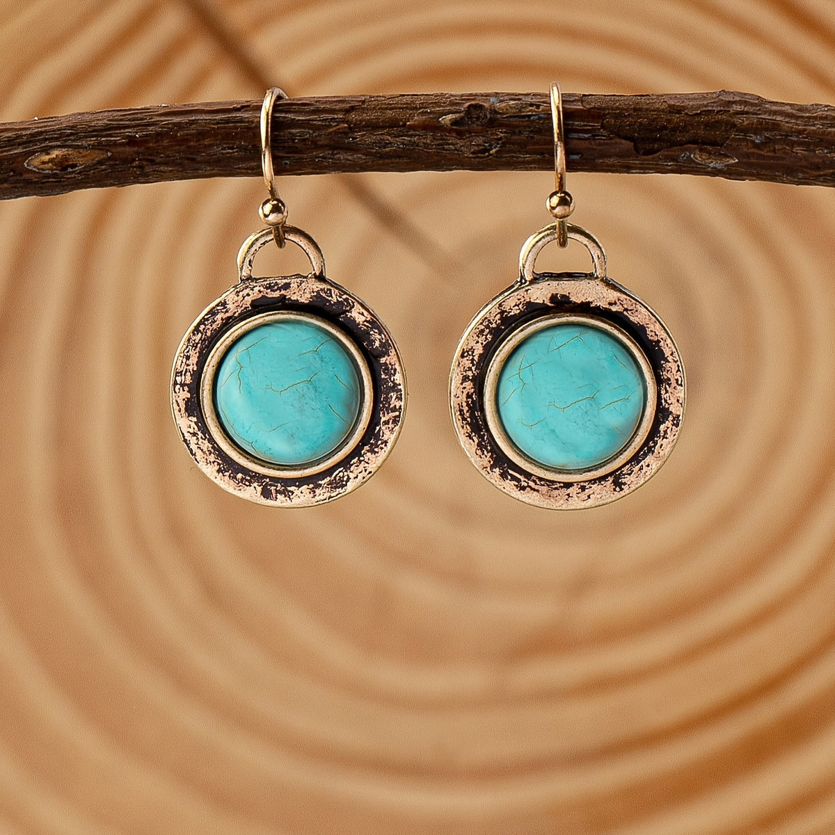 Goudkleurige vintage oorbellen met ronde turquoise