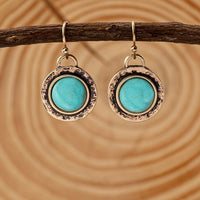 Goudkleurige vintage oorbellen met ronde turquoise