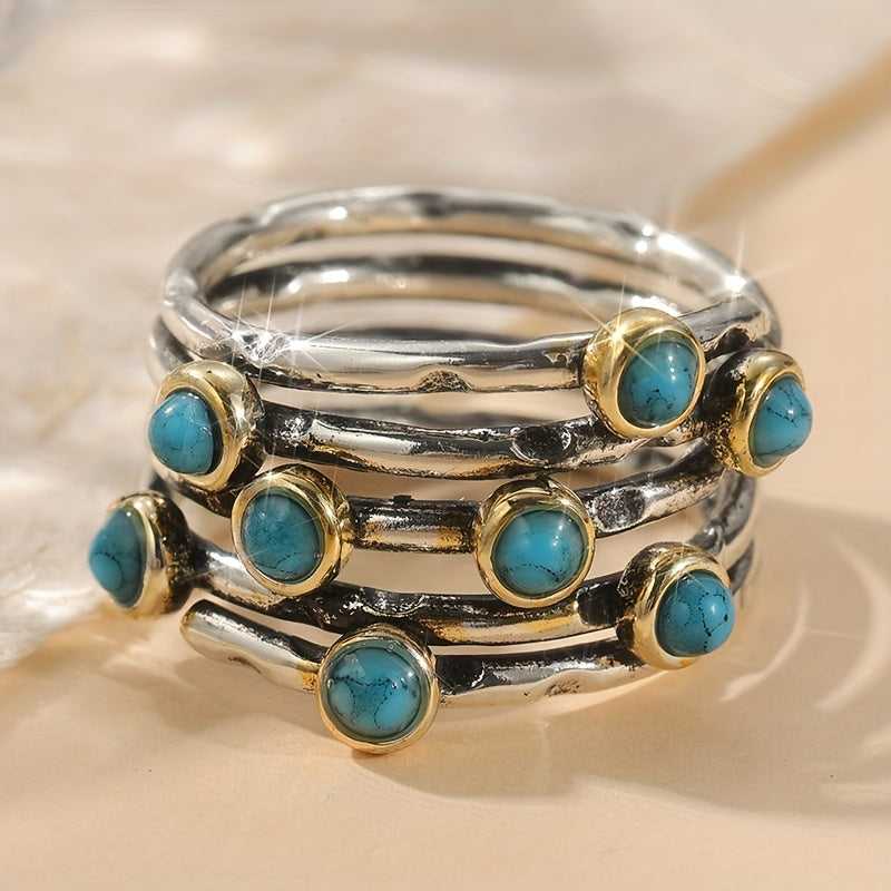 Zilveren ring met turquoise edelstenen en goudaccent