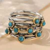 Zilveren ring met turquoise edelstenen en goudaccent