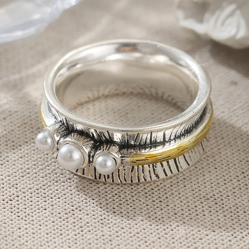 Zilveren ring met parels en goudkleurige spinner band