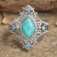 Zilveren vintage ring met marquise turkoois en blauwe steentjes