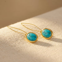 Gouden oorbellen met turquoise edelsteen