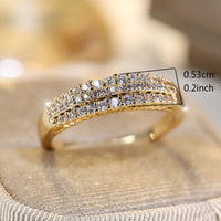 Gouden ring met drie rijen zirkonia