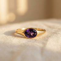 Gouden ring met paarse ovale amethist