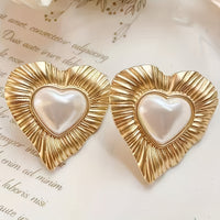 Gouden vintage hartoorbellen met parel