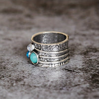 Zilveren spinner ring met blauwe edelstenen