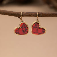Gouden oorbellen met turquoise hart