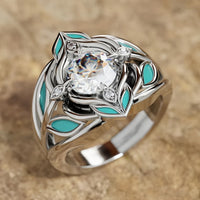 Zilveren ring met zirkonia en turquoise emaille blaadjes
