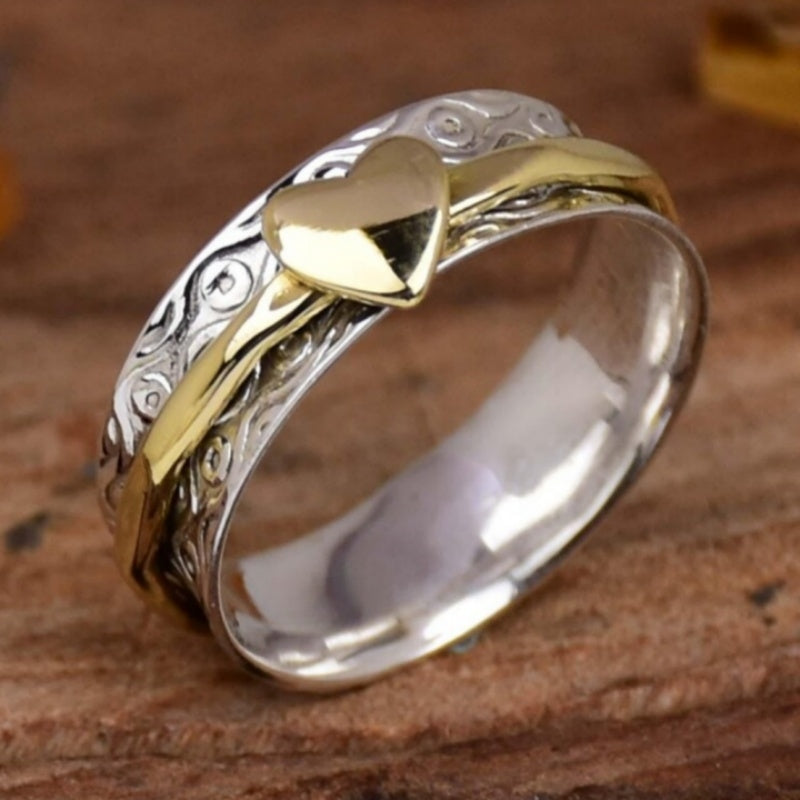 Zilveren gouden draairing met hart