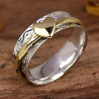 Zilveren spinner ring met gouden hart